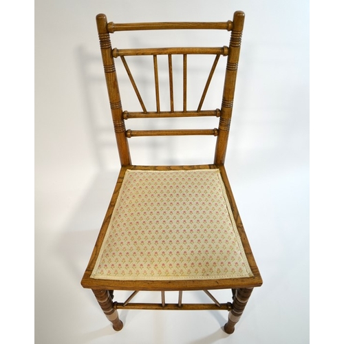 143 - Liberty and Co., a Thebes chair, circa 1880, ash and elm construction with upholstered seat, Liberty... 