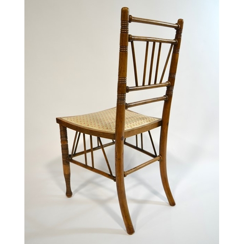 143 - Liberty and Co., a Thebes chair, circa 1880, ash and elm construction with upholstered seat, Liberty... 