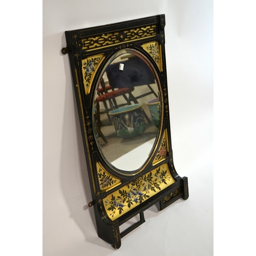 146 - An Aesthetic Movement ebonised mirror, circa 1880, painted with gilt backed floral motifs and blind ... 