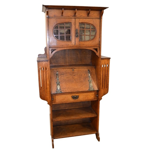 147 - A Glasgow School, Arts and Crafts oak bureau, in the style of Wylie and Lochhead, the fall front wit... 