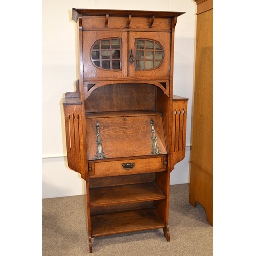 147 - A Glasgow School, Arts and Crafts oak bureau, in the style of Wylie and Lochhead, the fall front wit... 