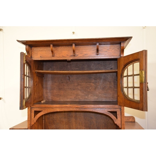 147 - A Glasgow School, Arts and Crafts oak bureau, in the style of Wylie and Lochhead, the fall front wit... 