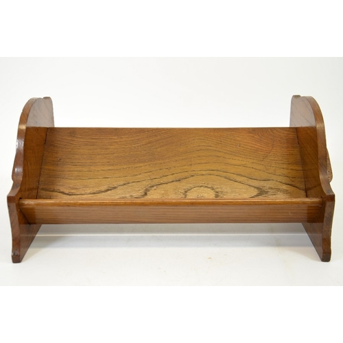 153 - An Arts and Crafts peg jointed oak book trough, 43cm wide