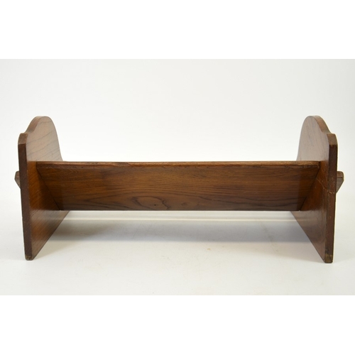 153 - An Arts and Crafts peg jointed oak book trough, 43cm wide