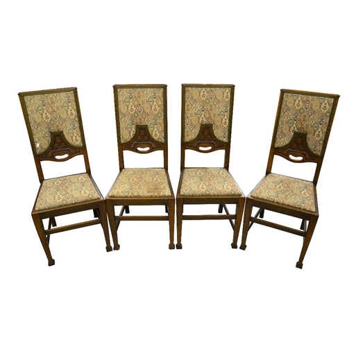 161 - A set of four Arts and Crafts oak dining chairs, upholstered seats and backs carved with tulip motif... 