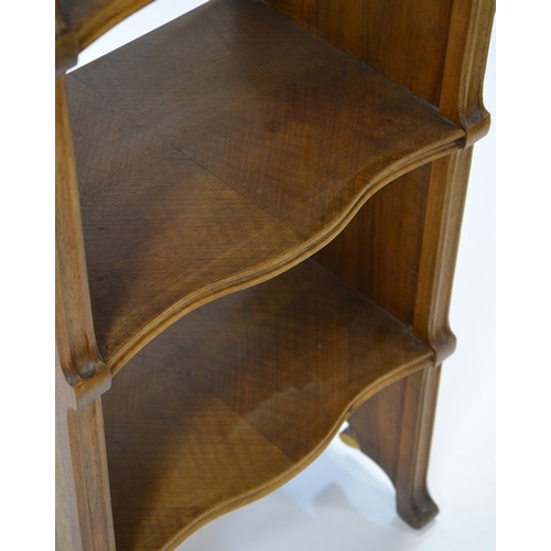 169 - Nancy School, an Art Nouveau marquetry bookcase, circa 1900, the four tier walnut unit with birdseye... 