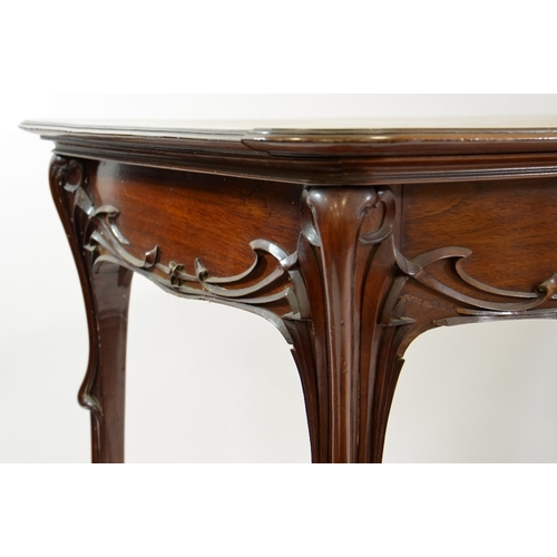 170 - Edward (Edouard) Colonna, an Art Nouveau walnut table, circa 1900, carved in relief with angular sin... 