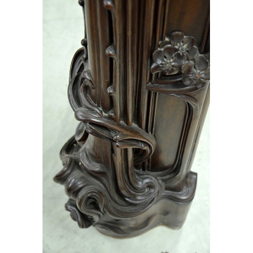 172 - Louis Majorelle (attributed), a large Art Nouveau carved walnut fire surround, circa 1900, modelled ... 