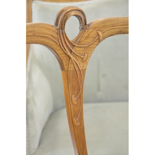 175 - Maurice Alet for La Ruche, an Art Nouveau walnut salon suite, circa 1900, carved with sinuous foliat... 