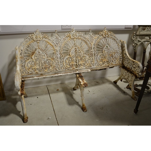 194 - A Victorian Coalbrookdale cast iron three seat garden bench, Arabesque design, three trefoil foliate... 