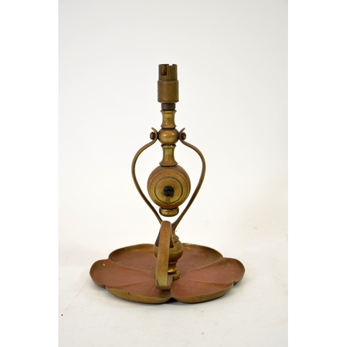 199 - W A S Benson, an Arts and Crafts copper and brass lamp, circa 1900, of wall hanging, chamberstick fo... 