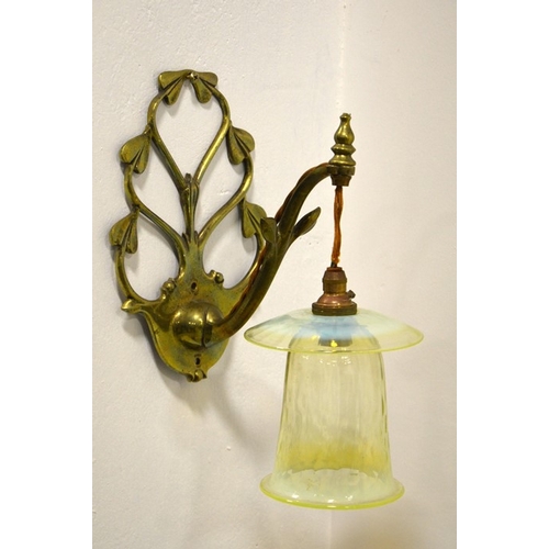 202 - W A S Benson and James Powell and Sons,  an Arts and Crafts brass wall light, model 1312, with hangi... 