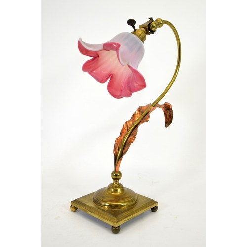 213 - An Arts and Crafts brass and copper table lamp, in the style of W A S Benson, on square base, with c... 