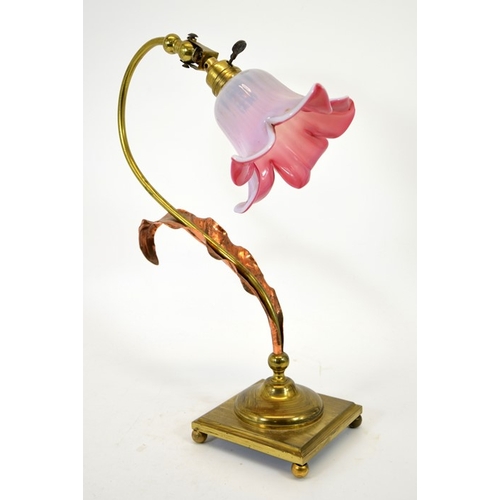 213 - An Arts and Crafts brass and copper table lamp, in the style of W A S Benson, on square base, with c... 