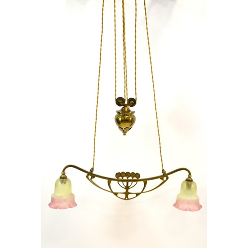 217 - An Arts and Crafts adjustable double pendant light fitting, circa 1900, the arm with central pierced... 