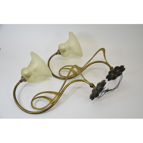 226 - A pair of Arts and Crafts brass and glass wall lights, the angular open tendril design arms supporti... 