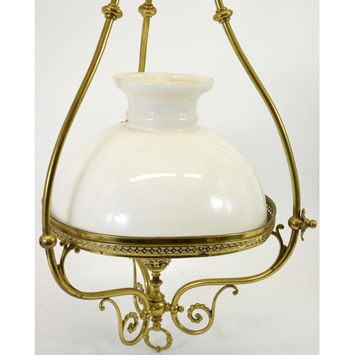 228 - A large Arts and Crafts brass pendant light fitting, circa 1896, the white opaque glass domed shade ... 