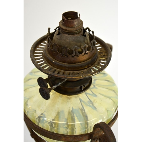 238 - James Powell and Sons, an Arts and Crafts opalescent glass and wrought iron table oil lamp, circa 18... 