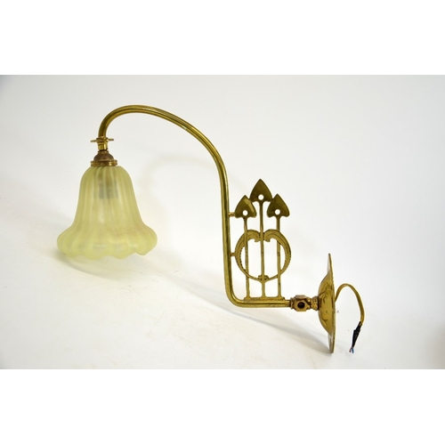 240 - An Arts and Crafts brass and opalescent glass wall light, the straw opal optic moulded shade, probab... 