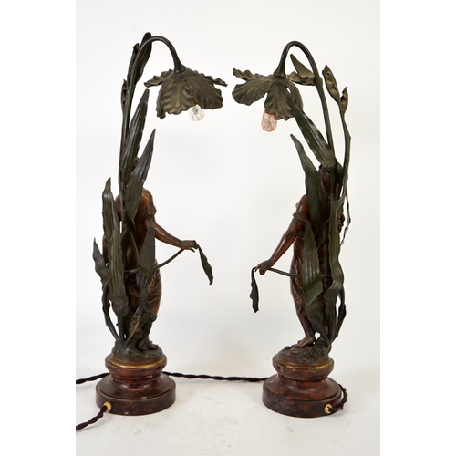 255 - Auguste Moreau, a pair of Art Nouveau bronzed figural table lamps, modelled as maidens in foliage, w... 