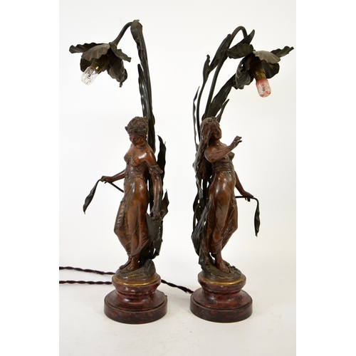 255 - Auguste Moreau, a pair of Art Nouveau bronzed figural table lamps, modelled as maidens in foliage, w... 