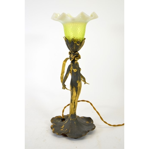 256 - An Art Nouveau gilt metal figural table lamp, circa 1900, modelled as a woman holding a strand of gr... 