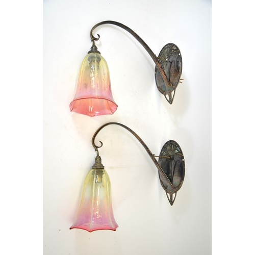 260 - A pair of Secessionist silvered copper and abalone wall mounted lights, the oval lobed and blind fre... 