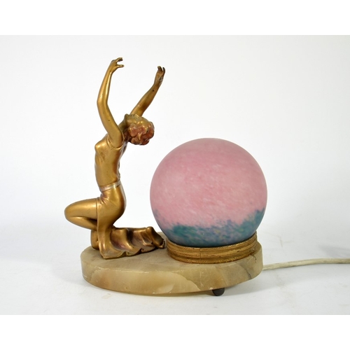 264 - An Art Deco figural table lamp, circa 1925, modelled as a kneeling woman arms raised, spherical glas... 