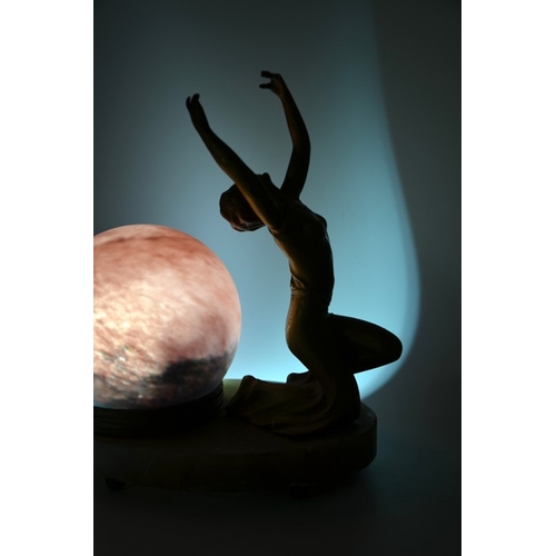 264 - An Art Deco figural table lamp, circa 1925, modelled as a kneeling woman arms raised, spherical glas... 