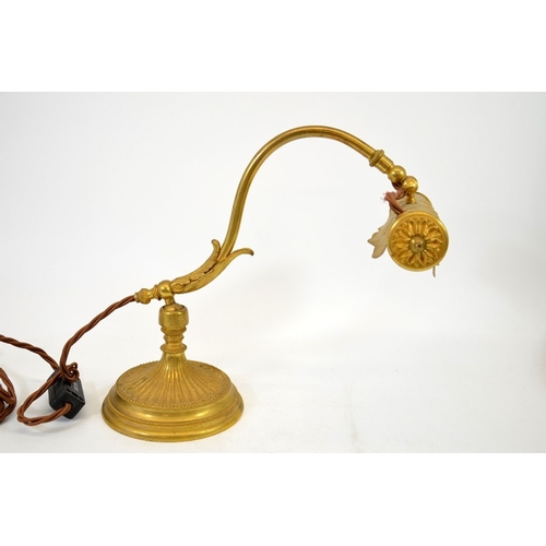 265 - A French ormolu reading lamp, circa 1900, cast and embossed gilt bronze with ball and socket fixing,... 