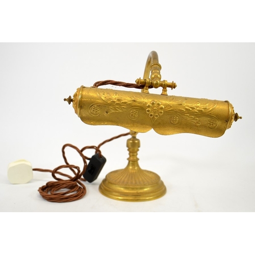 265 - A French ormolu reading lamp, circa 1900, cast and embossed gilt bronze with ball and socket fixing,... 