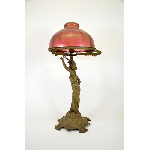 266 - An Art Nouveau figural table lamp with Loetz type iridescent glass dome shade, circa 1900, papillon ... 