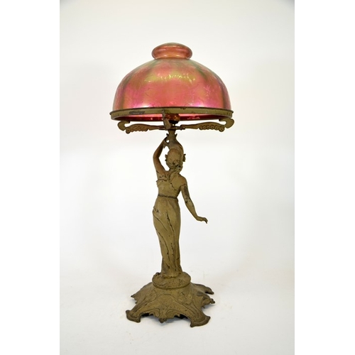 266 - An Art Nouveau figural table lamp with Loetz type iridescent glass dome shade, circa 1900, papillon ... 