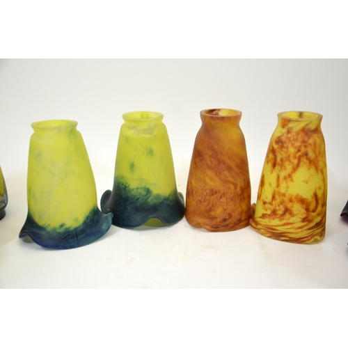 276 - A large collection of Tief art glass light shades, in the Daum style, marbled blue and yellow and pi... 