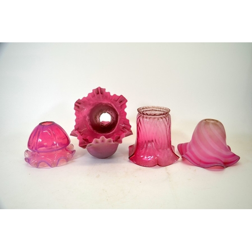 277 - A collection of cranberry glass light shades, including opalescent, optic moulded, pair of crimped o... 