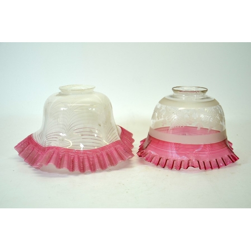 282 - Two Victorian glass light shades, each with red ribbon trailed borders to the crimped rims, one with... 