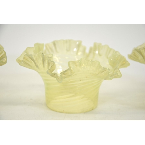 288 - A set of three Arts and Crafts opalescent vaseline glass light shades, collar form, moulded wrythen ... 