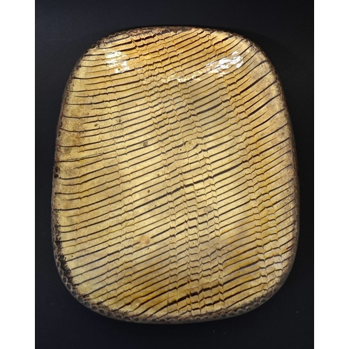 987 - An 18th century Staffordshire combed slipware dish, shallow rectangular form with diagonal stripe an... 