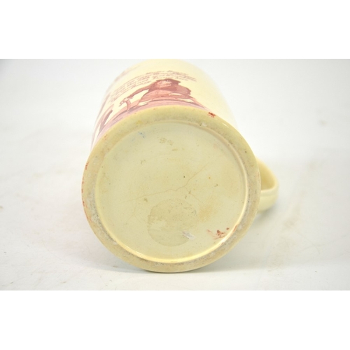 988 - A Napoleonic creamware cartoon mug, circa 1790-1810, red transfer printed decoration of Napoleon and... 