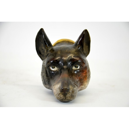 991 - A 19th century porcelain stirrup cup, modelled as a fox head, 12cm high