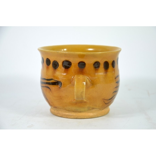 992 - An English slipware lowing cup, twin handled ogee form with dot and stripe decoration, circa 1750, 1... 