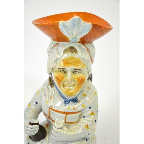 993 - A Prattware Toby Jug modelled as Martha Gunn, circa 1800, 28cm high