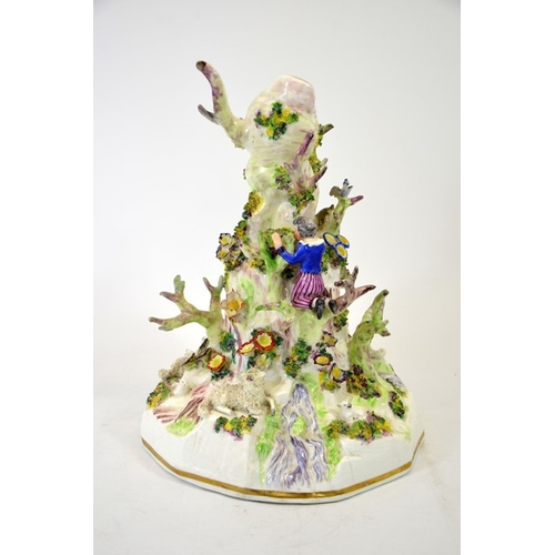 994 - A Staffordshire porcelain figure group, modelled as a tree stump with shepherd and sheep, child harv... 