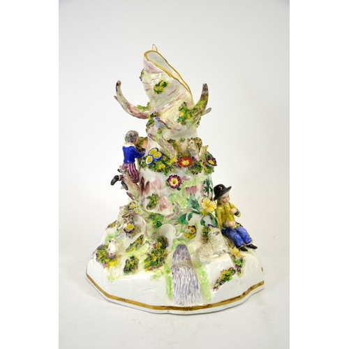 994 - A Staffordshire porcelain figure group, modelled as a tree stump with shepherd and sheep, child harv... 