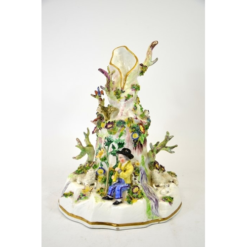 994 - A Staffordshire porcelain figure group, modelled as a tree stump with shepherd and sheep, child harv... 