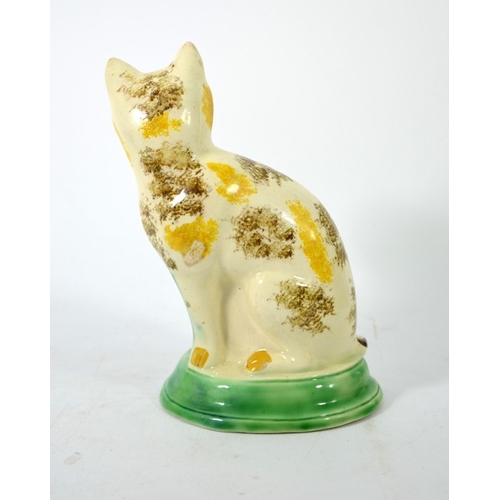 995 - A Staffordshire pottery figure of a cat, circa 1785, sponge decorated, in sitting position, 22cm hig... 