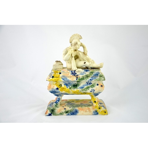 997 - A 19th century Prattware ink stand, sarcophagus form, the lid with a reclining Classical figure of a... 