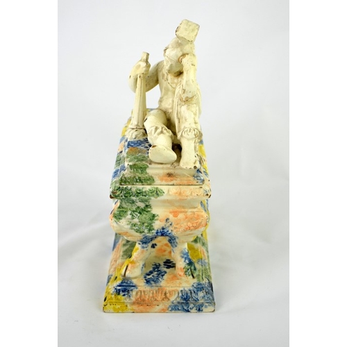 997 - A 19th century Prattware ink stand, sarcophagus form, the lid with a reclining Classical figure of a... 