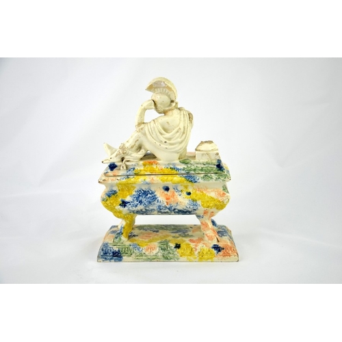 997 - A 19th century Prattware ink stand, sarcophagus form, the lid with a reclining Classical figure of a... 