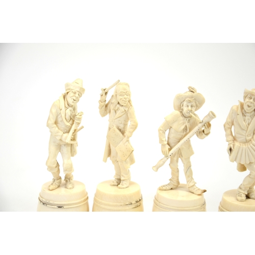 24 - λ A group of six 19th century Dieppe carved ivory figures of a musical band, stood on barrels, 15cm ... 